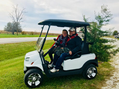 Owners, Abe and Janis in a Club Car Onward