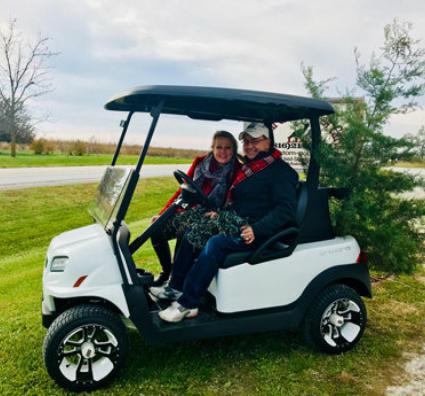 Owners, Abe and Janis in a Club Car Onward